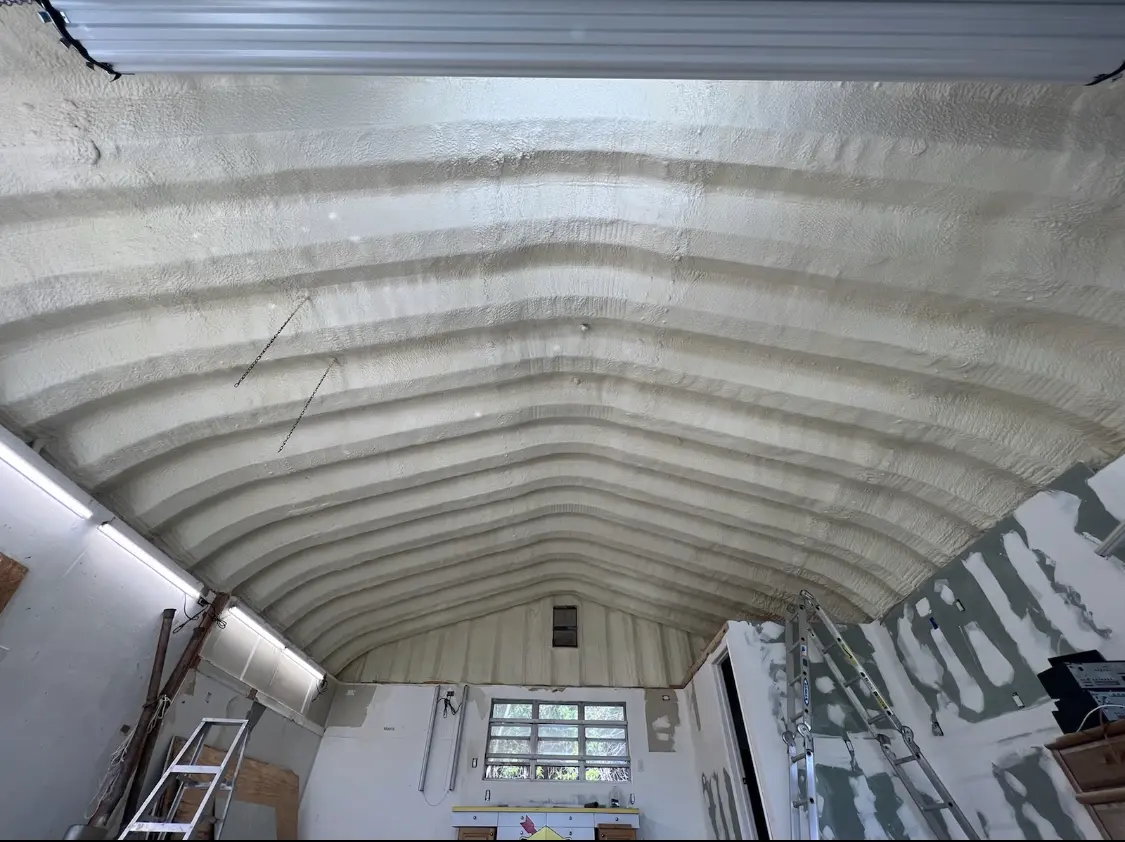 Spray polyurethane foam applied to the underside of a metal roof deck in Tumwater